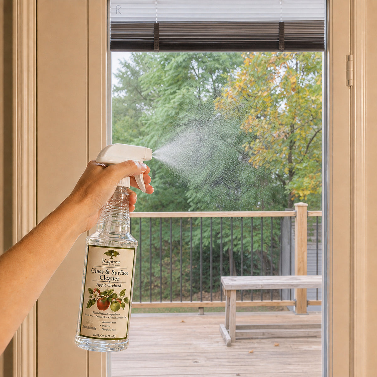 Raintree and Company Glass & Surface Cleaner, Apple Orchard scent, cleaning a glass door