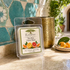 Raintree and Company 1oz Citrus Balm wax melt on a Mediterranean-style courtyard table